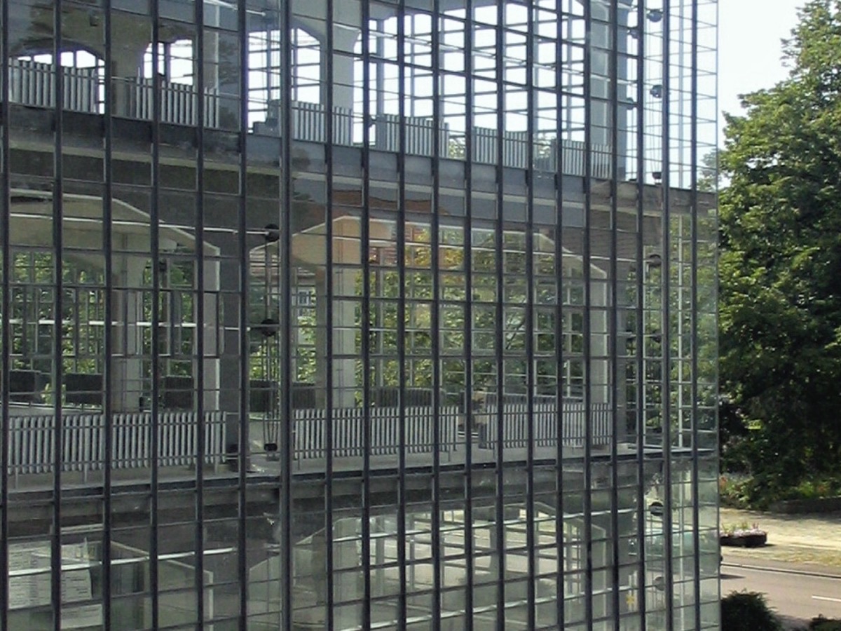 The glass curtain wall of the Bauhaus workshop wing, showing the structure through the glass